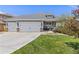 Charming single-Gathering home featuring a well-manicured lawn and a three-car garage at 16485 E 117Th Ave, Commerce City, CO 80022