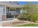 A charming front porch with rocking chairs and decorative plants, perfect for relaxing outdoors at 16485 E 117Th Ave, Commerce City, CO 80022