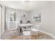 Bright home office featuring a modern adjustable desk, neutral paint, and a cowhide rug at 16485 E 117Th Ave, Commerce City, CO 80022