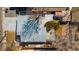 A bird's eye view of the home with backyard featuring patio, trees, and a well-maintained roof at 1027 Norfolk St, Aurora, CO 80011