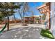 Backyard features a cozy firepit under a pergola, with ample space for relaxation and entertainment at 1027 Norfolk St, Aurora, CO 80011