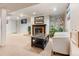 Spacious finished basement with carpet, fireplace, and two white couches at 1027 Norfolk St, Aurora, CO 80011