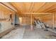 Rustic shed interior with wooden walls and floor, offering ample storage space at 1027 Norfolk St, Aurora, CO 80011