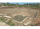 The foundation shows a formed foundation with reinforcement steel, ready for the next stage of building construction at 1222 S Algonquian St, Aurora, CO 80018