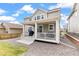Exterior view of the back of the home and its covered patio at 16108 Red Bud Loop, Parker, CO 80134