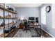 Modern home office with built-in shelving, a desk, and natural light, ideal for remote work at 16108 Red Bud Loop, Parker, CO 80134