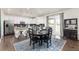 Beautiful kitchen with white cabinets, granite countertops, stainless steel appliances and a cozy dining area at 16108 Red Bud Loop, Parker, CO 80134