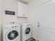 Functional laundry room with washer, dryer, cabinets and easy access to the outdoors at 16108 Red Bud Loop, Parker, CO 80134