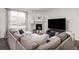 Cozy living room with a fireplace, comfortable seating, and ample natural light for relaxation at 16108 Red Bud Loop, Parker, CO 80134