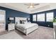 Inviting primary bedroom featuring a tray ceiling, generous windows, and an en-suite bathroom at 16108 Red Bud Loop, Parker, CO 80134