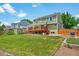 Backyard with deck, shed, patio, and well-maintained lawn at 2882 Signal Creek Dr, Thornton, CO 80241