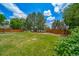 Green backyard with wooden fence at 2882 Signal Creek Dr, Thornton, CO 80241