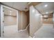 Finished basement space with neutral carpet and view of additional rooms at 2882 Signal Creek Dr, Thornton, CO 80241