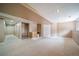 Spacious finished basement with neutral carpet, wet bar area and closet for storage at 2882 Signal Creek Dr, Thornton, CO 80241