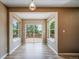 The dining room features sliding glass doors opening to the deck and large windows for natural light at 2882 Signal Creek Dr, Thornton, CO 80241