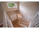 Grand foyer with an elegant chandelier, hardwood floors, and a bright window bringing natural light into the entryway at 2882 Signal Creek Dr, Thornton, CO 80241