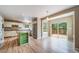 Modern kitchen with stainless steel appliances, granite countertops, and a center island with deck access at 2882 Signal Creek Dr, Thornton, CO 80241
