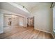 Spacious living area featuring hardwood floors, high ceilings, and open layout at 2882 Signal Creek Dr, Thornton, CO 80241