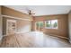 Spacious main bedroom with high ceilings, a ceiling fan, and deck access, filled with lots of natural light at 2882 Signal Creek Dr, Thornton, CO 80241