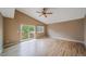 Main bedroom features a vaulted ceiling, ceiling fan, a sliding glass door leading to a private deck at 2882 Signal Creek Dr, Thornton, CO 80241