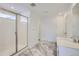 Bathroom with shower and double vanity at 5553 Wisteria Ave, Firestone, CO 80504