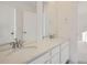 Double vanity bathroom with quartz countertops at 5553 Wisteria Ave, Firestone, CO 80504