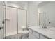 Bathroom with a shower/tub combo, white vanity, and marble-look flooring at 5553 Wisteria Ave, Firestone, CO 80504