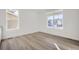 Bright dining room with vinyl plank flooring and large windows at 5553 Wisteria Ave, Firestone, CO 80504