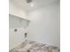 Laundry room with vinyl plank flooring and built-in shelving at 5553 Wisteria Ave, Firestone, CO 80504