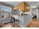 Kitchen with light wood cabinets and a breakfast bar at 1629 N Clarkson St # 28, Denver, CO 80218