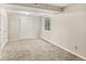 Finished basement featuring a closet and window, offering flexibility as an extra room or storage at 6429 S Jamaica Cir, Englewood, CO 80111