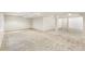 Expansive finished basement with neutral carpet and recessed lighting; ready for customization at 6429 S Jamaica Cir, Englewood, CO 80111