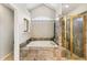 Bathroom features large soaking tub with tile surround and glass enclosed shower at 6429 S Jamaica Cir, Englewood, CO 80111