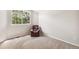 Cozy bedroom featuring an armchair, plush carpet, and a bright window at 6429 S Jamaica Cir, Englewood, CO 80111