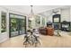 Bright dining area featuring natural light, modern lighting and decor, and a seamless transition to outdoor space at 6429 S Jamaica Cir, Englewood, CO 80111