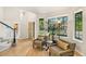 Warm and inviting foyer with hardwood floors, natural light and cozy seating area at 6429 S Jamaica Cir, Englewood, CO 80111