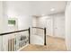 Upstairs hallway with carpet and white doors leads to various rooms at 6429 S Jamaica Cir, Englewood, CO 80111