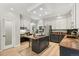 Modern kitchen with an island gas stovetop and a suite of stainless steel appliances and a white ceiling at 6429 S Jamaica Cir, Englewood, CO 80111