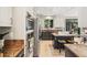Chef's kitchen featuring stainless steel appliances, granite countertops, and an island with seating at 6429 S Jamaica Cir, Englewood, CO 80111