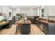Well-appointed kitchen featuring a central island, custom cabinets, and modern stainless steel appliances at 6429 S Jamaica Cir, Englewood, CO 80111