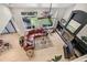 Bright living room boasts fireplace, large windows, and comfortable seating at 6429 S Jamaica Cir, Englewood, CO 80111