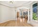 Elegant living room with arched entrance, columns, and large windows offering beautiful views at 6429 S Jamaica Cir, Englewood, CO 80111