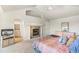 Main bedroom with fireplace and adjoining bathroom for added convenience at 6429 S Jamaica Cir, Englewood, CO 80111