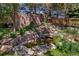 Beautiful backyard rock waterfall feature creates a serene and relaxing outdoor space at 6429 S Jamaica Cir, Englewood, CO 80111