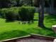 Green community area featuring ducks and geese families amongst lush green landscaping at 15395 E Penwood Pl, Aurora, CO 80015