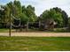 Neighborhood playground featuring a slide, volleyball net, and climbing structure at 15395 E Penwood Pl, Aurora, CO 80015