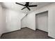 A bedroom with neutral walls, carpeted floors, ceiling fan and closet at 46 Silver Creek Rd, Idaho Springs, CO 80452