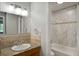 Bathroom features vanity with granite counters, a tub, and modern fixtures at 5995 E Iliff-1 Ave # 309, Denver, CO 80222