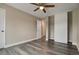 Bedroom with hardwood floors and a closet with white sliding doors at 5995 E Iliff-1 Ave # 309, Denver, CO 80222