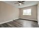 Bright bedroom featuring hardwood floors, a ceiling fan, and a window with a pleasant view at 5995 E Iliff-1 Ave # 309, Denver, CO 80222